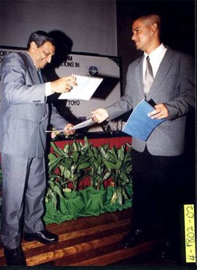 A much younger me (right) at the MOU signing ceremony with Dr. John (left), then a key figure of the NITC.